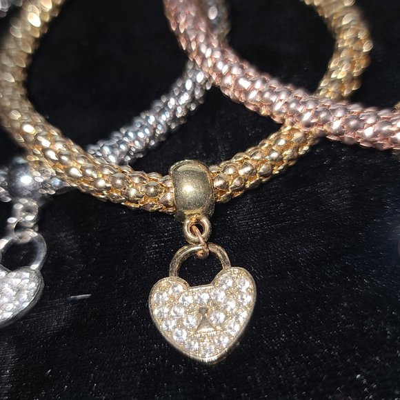 Set of three bracelets with rhinestone heart. Silver, Gold, Rose gold colours. - Picture 2 of 2